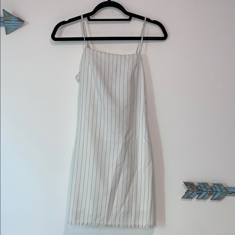 Striped body con dress. Ties in the back